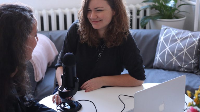 Two women podcasting